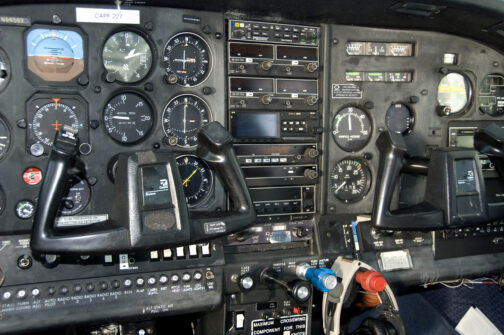 dashboard of an aircraft control panel showing all of the navigation gages, dials and other radio connectivity instruments